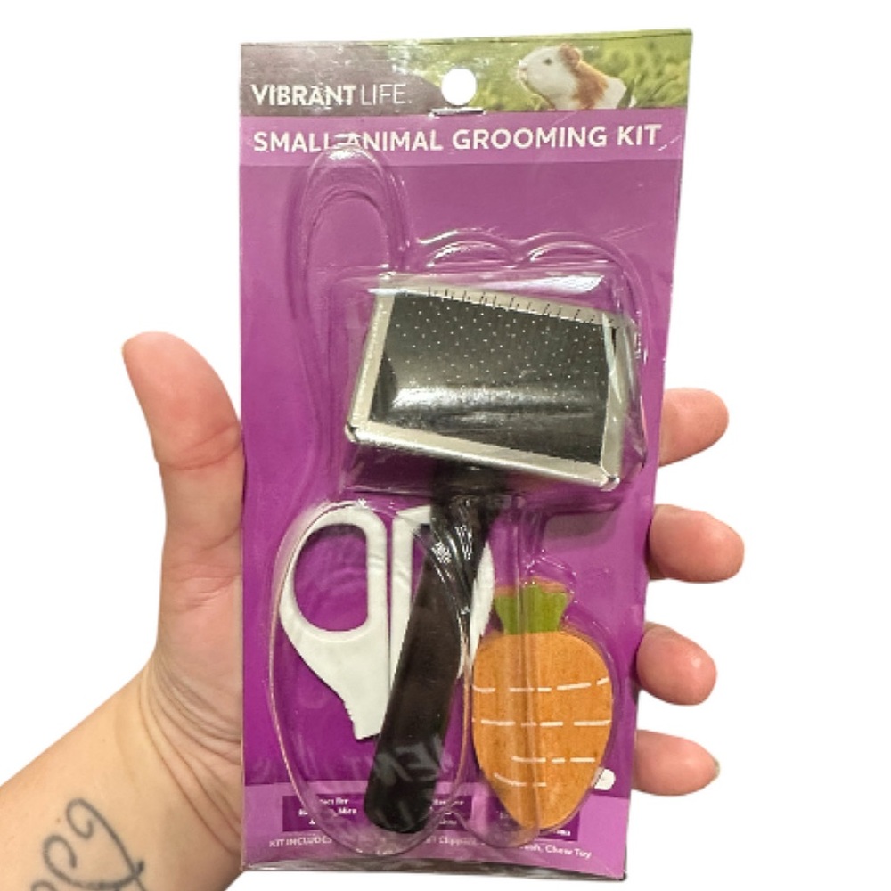 Part Of A Vibrant Purple Small Animal Grooming Set